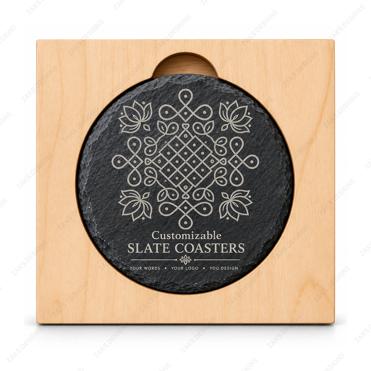 A round black slate coaster with a white engraved geometric floral pattern and the text 'Customizable SLATE COASTERS' at the bottom, mounted on a square light wood display block against a white background.