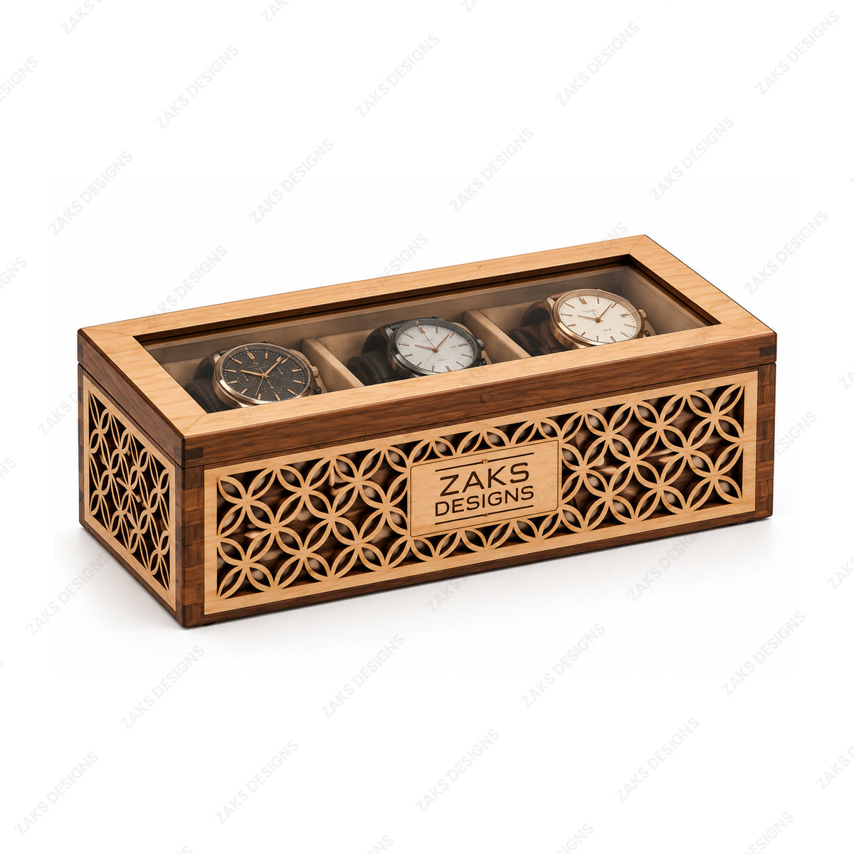 A rectangular wooden watch display box with a transparent top, three watch slots, and laser-cut geometric patterns on the front. The box is branded with a plaque reading 'ZAKS DESIGNS' and contains three watches under a clear lid.