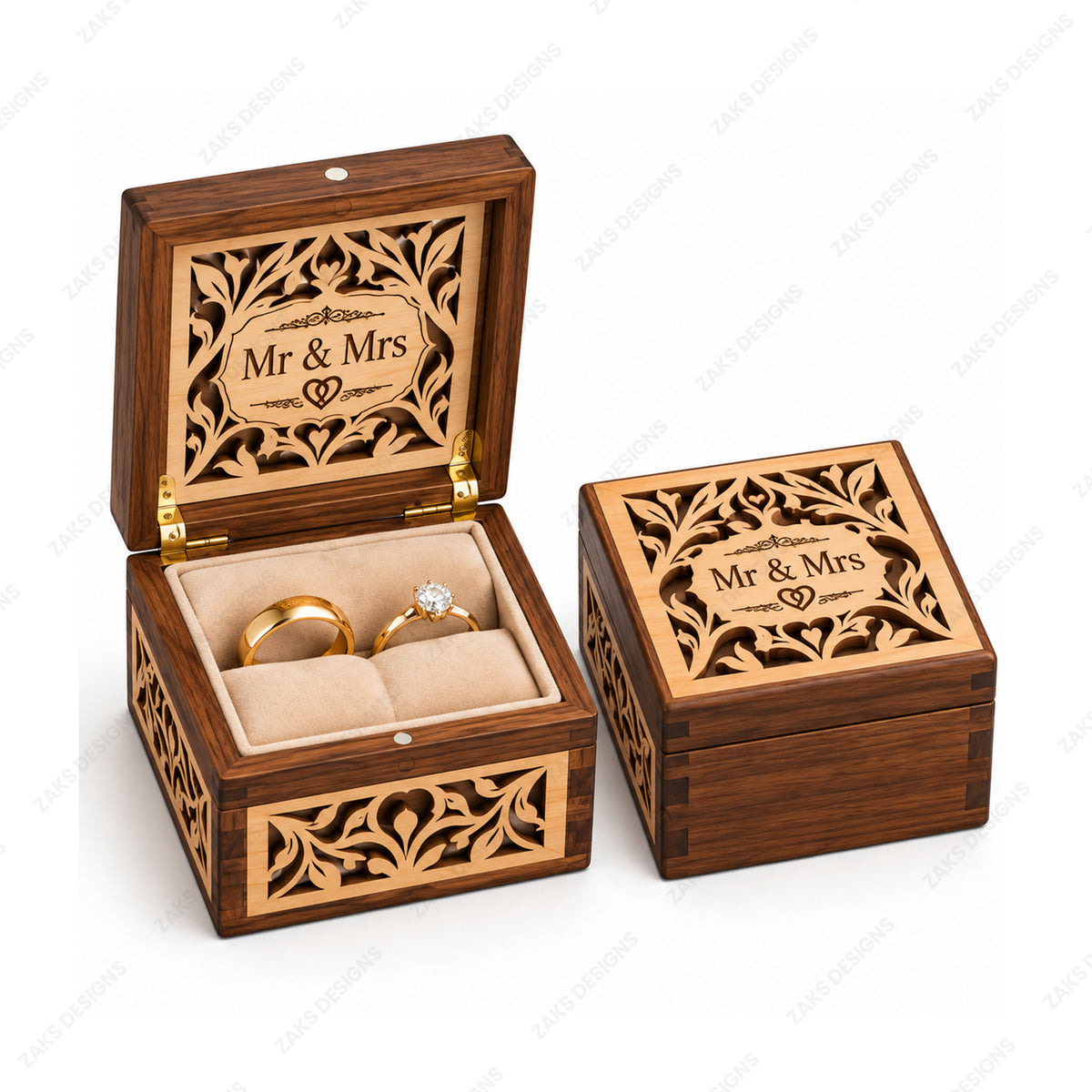 Two personalized wooden ring boxes with laser-engraved floral patterns and 'Mr & Mrs' text on the lid, one open displaying gold rings on a beige velvet insert and one closed showing the exterior, on a white background.