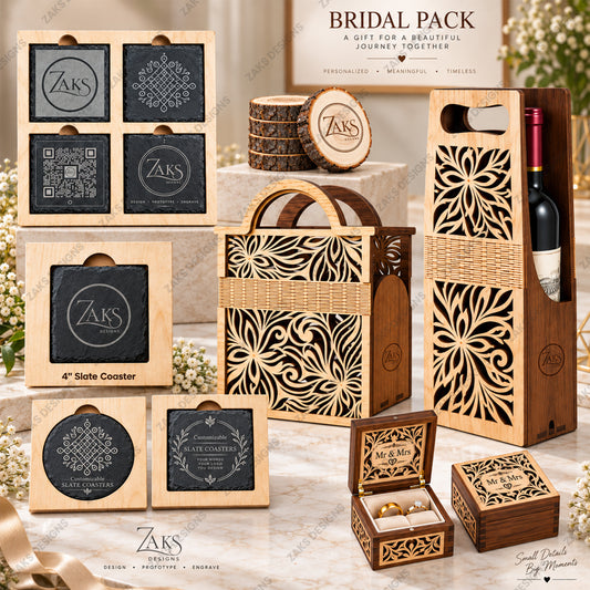Bridal gift set featuring personalized wooden coasters, a wooden wine bottle carrier with laser-cut floral patterns, a woven tote bag, and engraved wooden boxes, all arranged on a marble surface with floral props. The set includes ZAKS branding and a 'Bridal Pack' title card at the top.